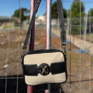 Lightweight coach crossbody bag with rustic design
