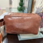 Leather toiletry bag with waterproof lining and interior pockets