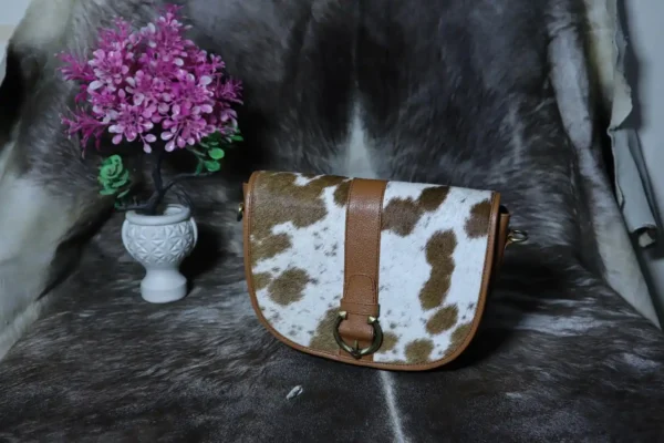 Cowhide buckle crossbody bag with flap closure in genuine leather
