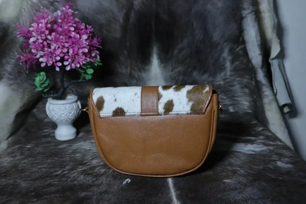 Cowhide buckle crossbody bag with flap closure in genuine leather