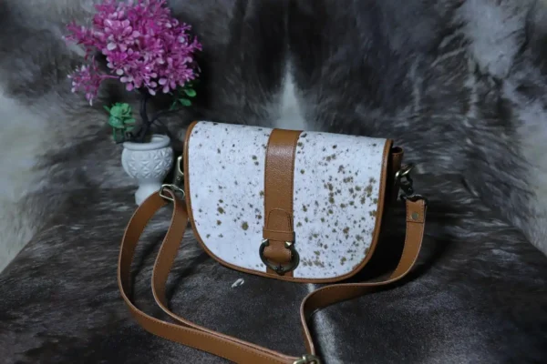 Cowhide buckle crossbody bag with flap closure in genuine leather