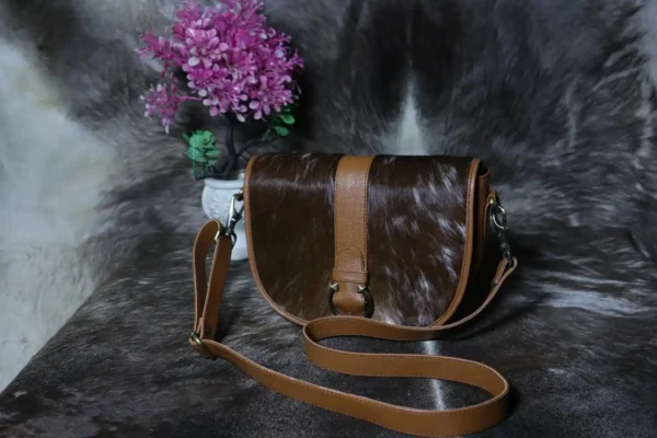Cowhide buckle crossbody bag with flap closure in genuine leather
