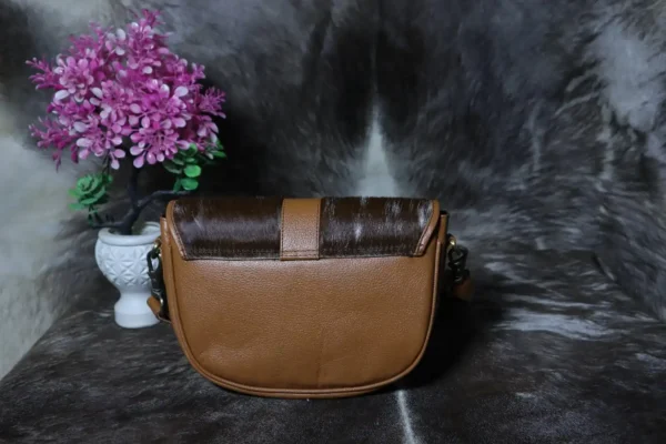 Cowhide buckle crossbody bag with flap closure in genuine leather