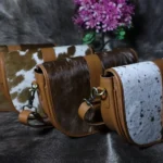 Cowhide buckle crossbody bag with flap closure in genuine leather