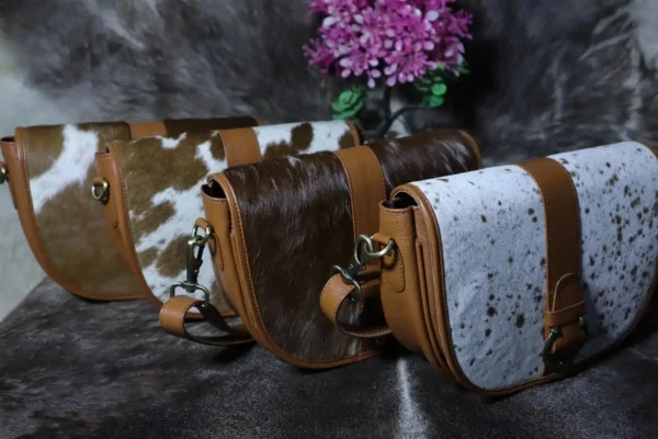 Cowhide buckle crossbody bag with flap closure in genuine leather