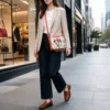 Women cowhide crossbody bag box style purse in black brown and orange leather finish with adjustable strap, large compartment and inside pocket