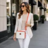 Women cowhide crossbody bag box style purse in black brown and orange leather finish with adjustable strap, large compartment and inside pocket