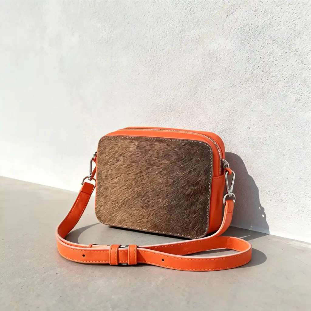 Leather cowhide crossbody bag box style purse for women in black brown and orange with adjustable strap large compartment and inside pocket