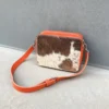 Leather cowhide crossbody bag box style purse for women in black brown and orange with adjustable strap large compartment and inside pocket