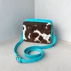 Shop blue cowhide crossbody bag for women in Australia. Box style leather purse with large space, inside pocket & premium finish. Buy online today.