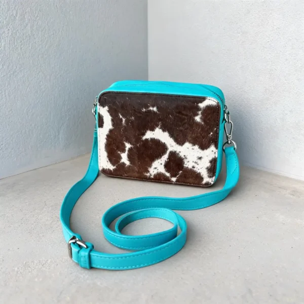 Shop blue cowhide crossbody bag for women in Australia. Box style leather purse with large space, inside pocket & premium finish. Buy online today.