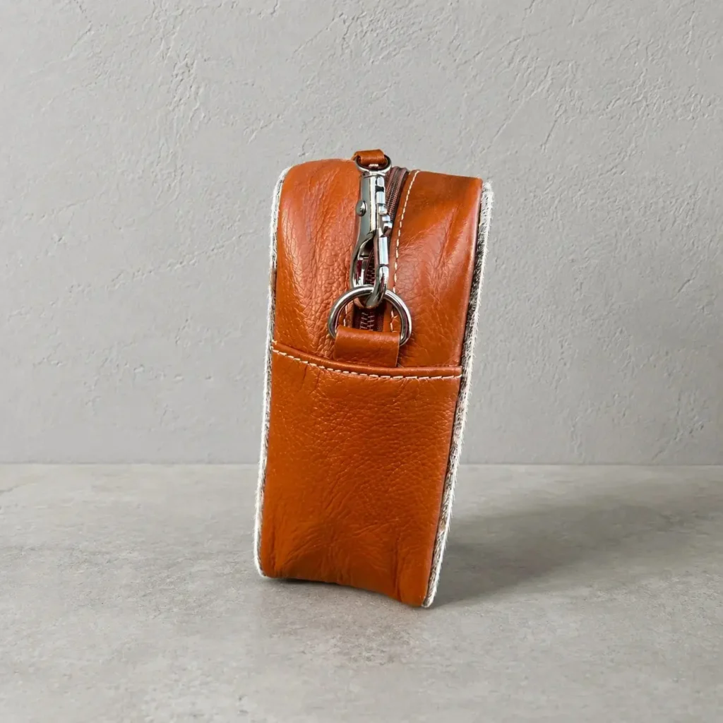 Tan cowhide crossbody bag box style purse for women with natural cowhide leather texture, structured design, adjustable long strap, large compartment and inside pocket