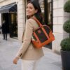 Orange cowhide leather tote bag for women with classic design