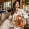 Large orange cowhide tote bag for women made from genuine leather