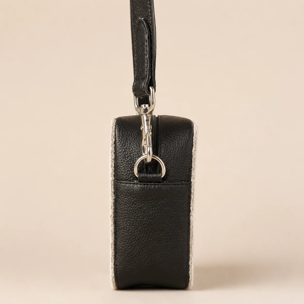 Black cowhide crossbody bag with box style shape, cow finish leather, long strap, large compartment and inside pocket