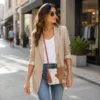Tan and white cowhide mobile phone pouch square style with zipper pocket, cow finished leather strap and adjustable shoulder bag design