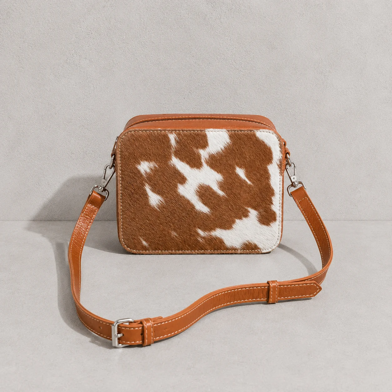 Tan leather cowhide crossbody bag box style purse for women with adjustable strap, large main compartment and inside pocket, structured design