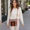 Handmade Durri fabric crossbody purse with hand tooled leather detail