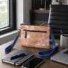 Hand tooled cowhide phone pouch with adjustable shoulder strap