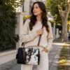 Cowhide mini duffel bag in black and brown with shoulder strap