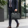 Natural leather laptop bag with multiple pockets and shoulder strap