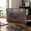 Natural leather laptop bag with multiple pockets and shoulder strap