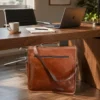 Brown leather laptop bag messenger style with shoulder strap