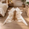 Calf hide rug white and caramel brown speckled - bedroom