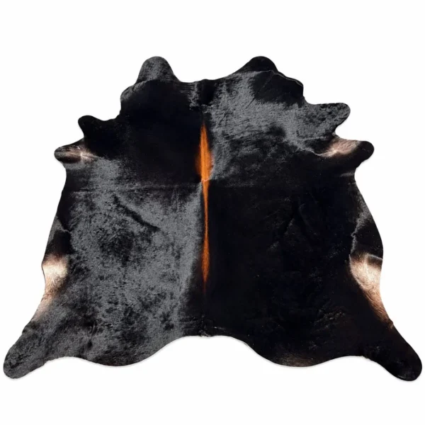 Brazilian cowhide rug in black with brown spine made from genuine cowhide shown on a white background