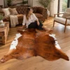 Brazilian cowhide rug in chestnut and white made from genuine cowhide shown in an Australian living room