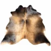 Brazilian cowhide rug in light brindle tan made from genuine cowhide shown on a white background