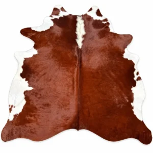 Brazilian cowhide rug in reddish brown and white made from genuine cowhide shown on a white background
