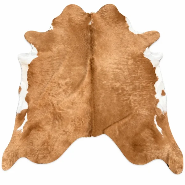 Brazilian cowhide rug in tan and white made from genuine cowhide shown on a white background