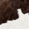 Calf hide rug chocolate brown white - closeup texture