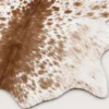 Calf hide rug white and caramel brown speckled - closeup texture