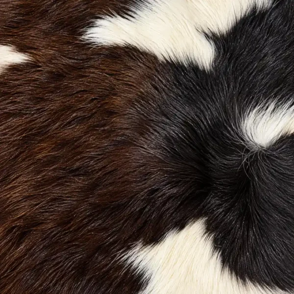 Calf hide rug dark brown white - closeup texture