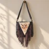 Black cowhide crossbody purse with hand tooled bull head patch