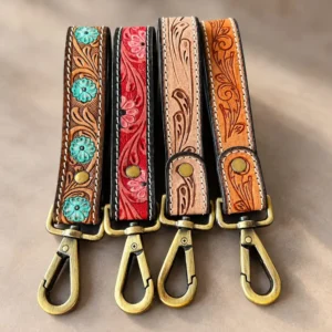 Hand tooled leather keychains, four western floral designs